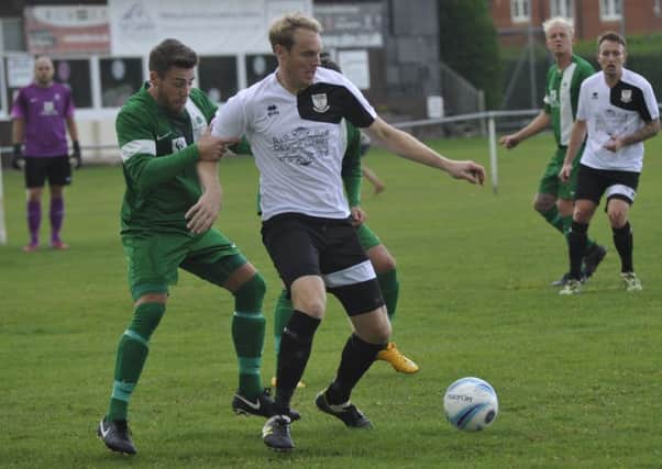 Drew Greenall on the ball during Bexhill United's home match against Mile Oak last month. Picture by Simon Newstead