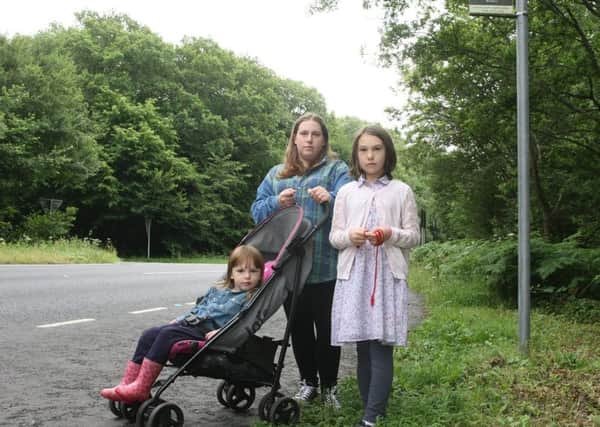 DM17631710a.jpg Lucy Stanton pictured in June with daughters Shannon and Tegan-rose after raising concerns over buses not stopping on the A24. Photo by Derek Martin. SUS-170630-181059008