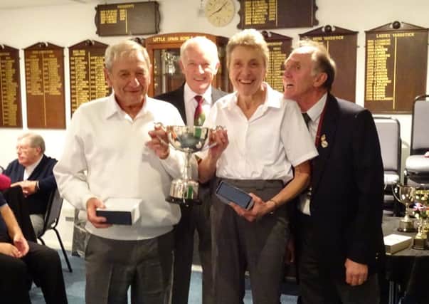 The mixed pairs trophy is presented at Little Spain