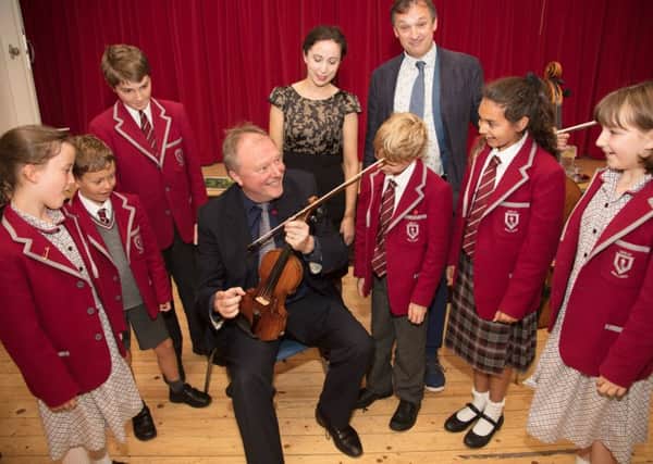 The moment pupils found out that the violin was worth over three million pounds