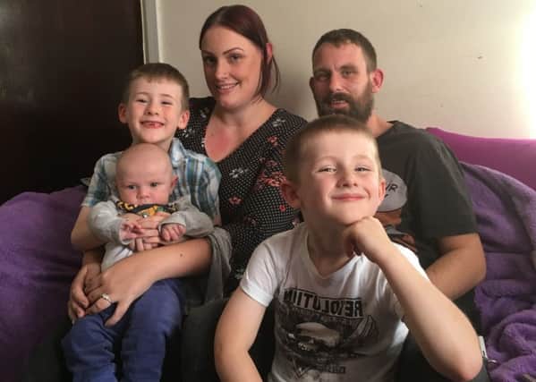 Sabrina Wales, 28, and Gareth Nosworthy, 31, with Caiden, six, Archie, four and Hunter, 15 weeks.