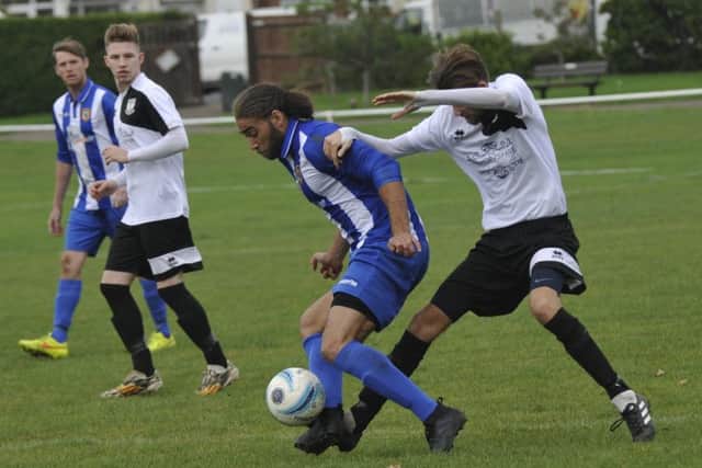 Nathan Lopez goes in for a tackle against Lingfield.