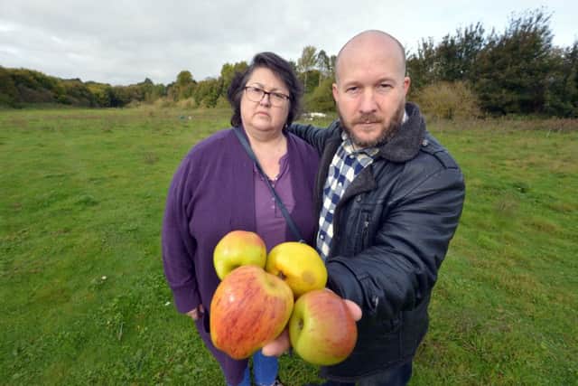 Just four apples were overlooked in the raid ... Mathew Moulding and Helen Chiasson at The Secret Orchard