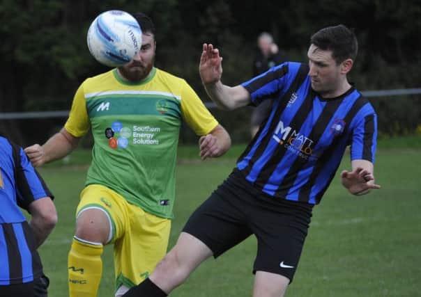 Westfield midfielder Jake Adams tussles for possession. Pictures by Simon Newstead