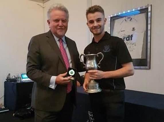Sir Rod Aldridge presents Nick Oxley with the Academy Player of the Year Award