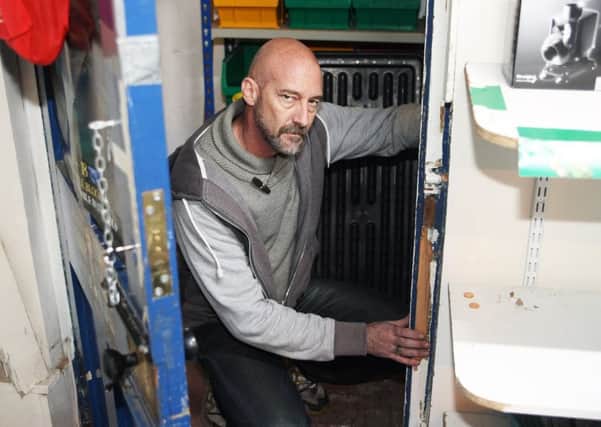 Shop owner Steve Coombes (pictured) said the thief or thieves smashed through the inner back door. Pictures: Derek Martin