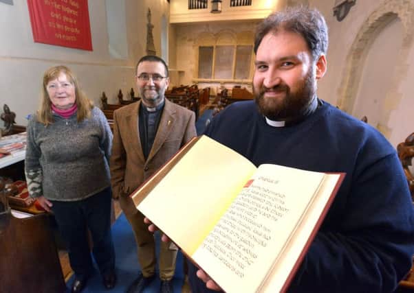 Father James Grant, chairman of Shoreham Churches Together, with The Shoreham Gospels, the Rev Martin Lloyd-Williams, Archdeacon of Bishop and Lewes, and project co-ordinator Jeannette Simpson. Picture: Peter Cripps 21-10-17 (04)