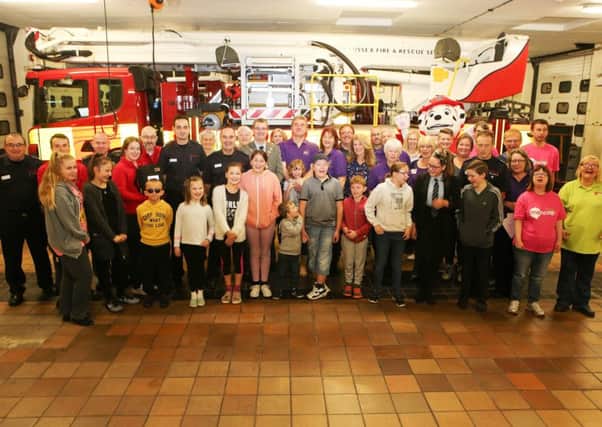 Celebrating donations made to good causes following the annual Broadwater Carnival and Worthing Fire Station open day. Picture: Eddie Mitchell