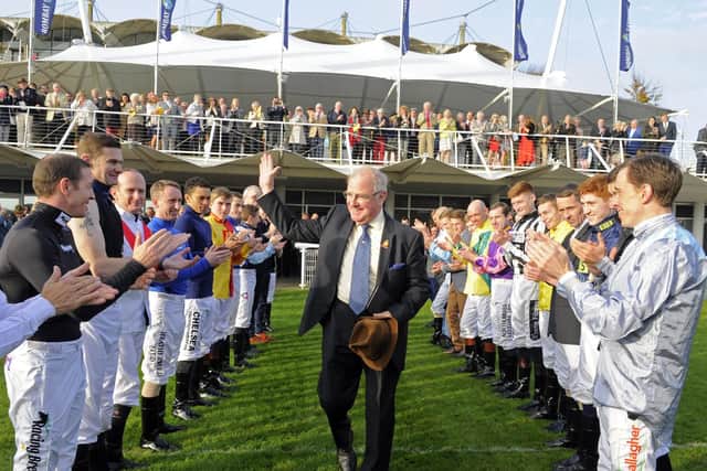 Seamus Buckley gets a guard of honour from the jockeys / Picture by Malcolm Wells