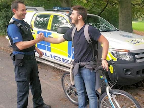 PCSOAndy Mcallister reunited Georgios Pichis with his bike (Photograph: Sussex Police)