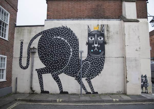 The 'King of Cats' created by Belgian artists Joachim, next to JPS' 'Big Deal' behind Superdrug in East Street