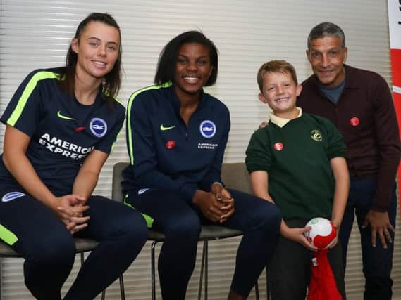 Laura Rafferty, Ini Umotong and Chris Hughton with a student at the event