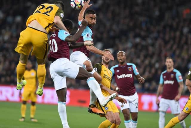 Shane Duffy wins a header at West Ham. Picture by Phil Westlake (PW Sporting Photography)