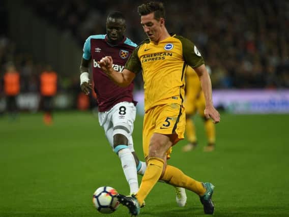 Lewis Dunk in action at West Ham on Friday. Picture by Phil Westlake (PW Sporting Photography)