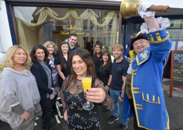 Laroma Therapies celebrates its second birthday.
Lauren Vaughan with staff and well wishers, and town crier Bob Smytherman. Picture: Peter Cripps