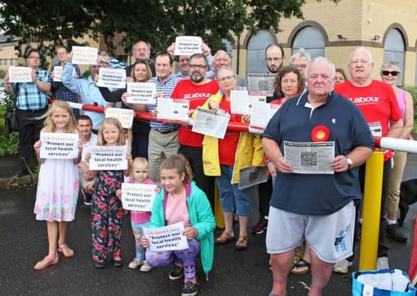 Councillors and residents protesting against the collapse of plans to build a GP surgery next to Morrisons in Wick. Photo by Derek Martin