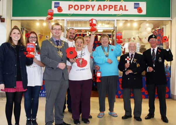 Worthing mayor Alex Harman opens the Poppy Appeal shop in the Guildbourne Centre. Photo by Derek Martin DM17103342a