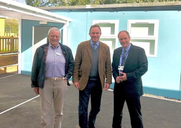 Ray Jackson, chair of governors, Nick Herbert MP, and Jon Gilbert, headteacher, outside the new classroom at Amberley CE Primary School