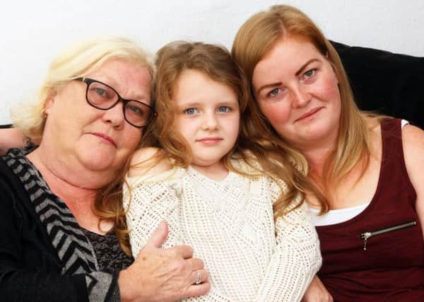 Gillian Clifford, supporting the PIP campaign, with her daughter Mary-Kate, who has epilepsy, and granddaughter Katie. Picture: Derek Martin DM17103363a
