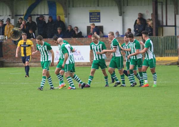 Chi City players celebrate Ellis Martin's goal at Eastbourne / Picture by Joe Knight