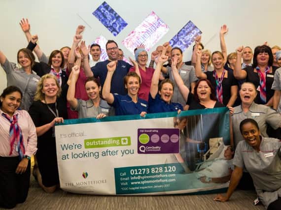 Staff celebrate 'outstanding' rating