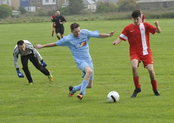 Action from the 5-5 draw between AFC Hollington and Beckley Rangers in Division Five. Pictures by Simon Newstead