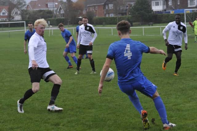 Wayne Giles closes down a Midhurst opponent.