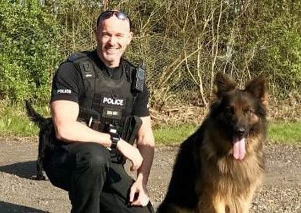 Max the police dog and handler PC Mark Fox