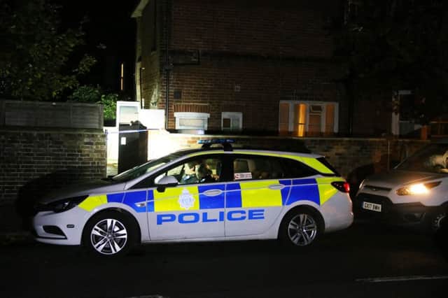 Police at the scene in Tarring Road last night. Photo by Eddie Mitchell