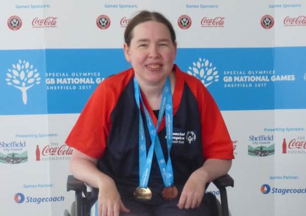 Bexhill Swimming Club talent Kirsty Stewart with her medals at the Special Olympics National Summer Games.