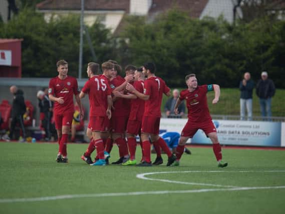 Worthing celebrate a goal during their first-round qualifying win over Lowestoft Town on Saturday. Picture by Marcus Hoare