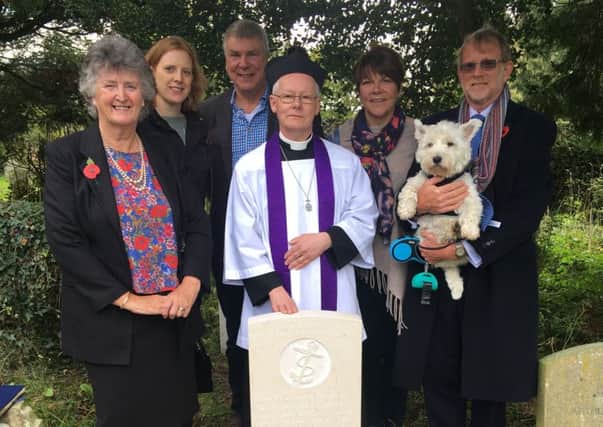Relatives of WWI sailor Bob Weaver with the Rev Nick Flint and the new headstone supplied by the Commonwealth War Graves Commission