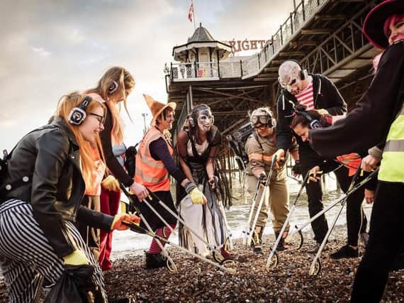 The Monster Mash: Ghouls clean up the beach at silent disco