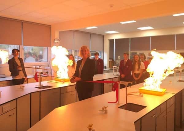 Jane Green cuts the ribbon to launch the new science labs