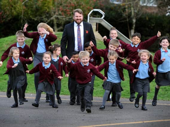 Headteacher James Field and some of the children from St Robert Southwell Catholic Primary School