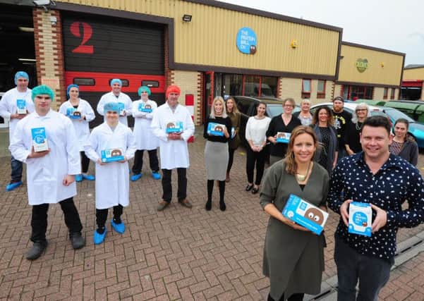 Matt and Hayley Hunt, founders of The Protein Ball Co, front right, with the team outside their Worthing base. Picture: Kate Shemilt ks171097-1