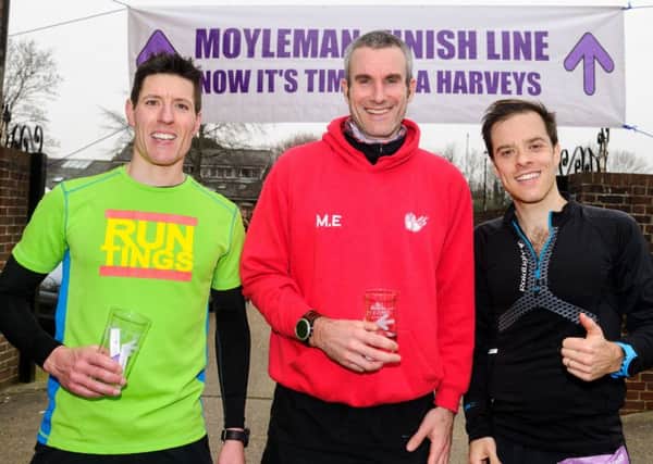 The first three across the finish line in this year's Moyleman. From left: Paul Sargent (3rd), Mike Ellicock (1st) and Mark Innocenti (2nd). Photograph by James McCauley