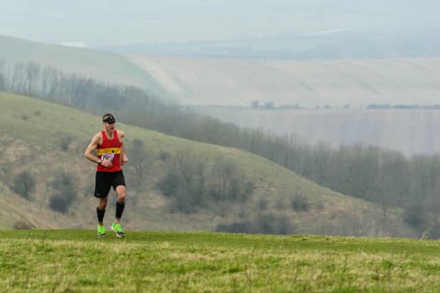 Mike Ellicock leading the way up to Firle Beacon in this year's Moyleman. Photograph by James McCauley