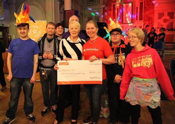 Superstar Arts receives the cheque from The Santander Foundation's Discovery Grants