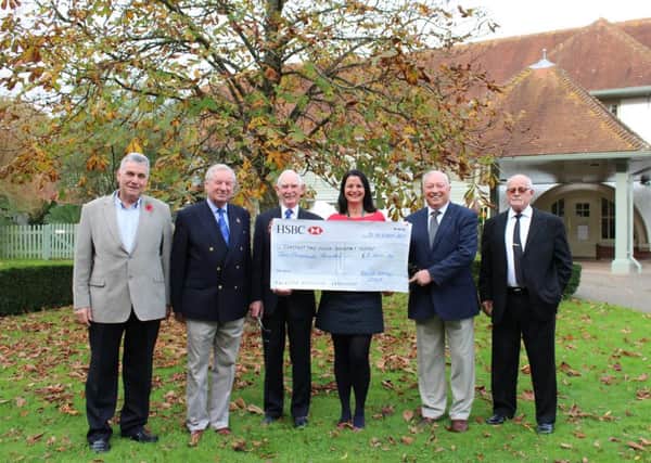 Caroline Roberts-Quigley, community fundraiser at Chestnut Tree House, with Brook Barn Lodge members, from left, Bill Frecknall, John Byford, Eric Mardell, Charlie Ward and Mick Boyland