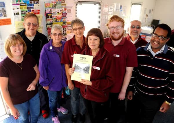 Wick Information Centre manager Julie Roby with volunteers celebrating its 20th birthday Picture: Steve Robards SR1726571