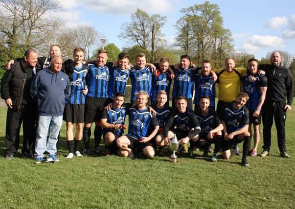 Hollington United celebrate winning the Macron East Sussex Football League Premier Division title at the end of last season.