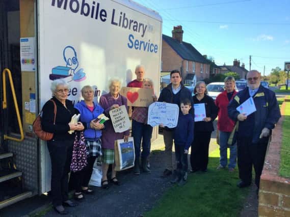 Huw Merriman MP with residents of Hooe at the council's mobile library service SUS-170111-122717001