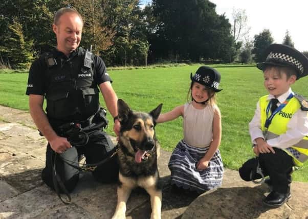 Danny Herbert and his sister Sky meeting the police dog unit. Sussex Police pictures