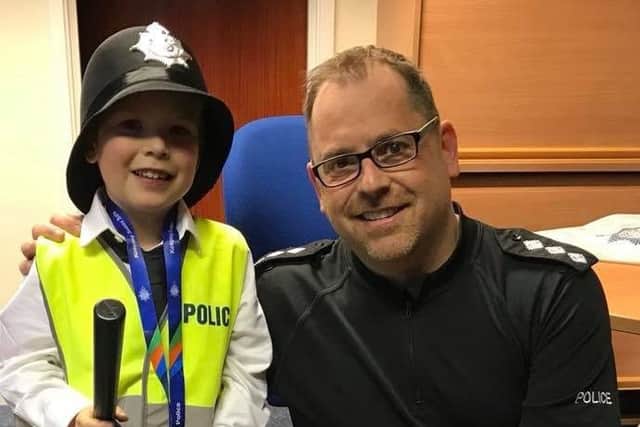 Ch Insp Justin Burtenshaw, pictured with young Danny Herbert from Bognor