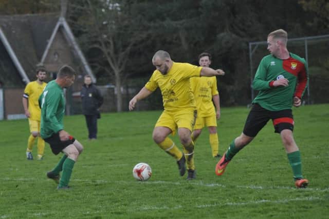 Midfield action from Bexhill AAC II's 8-2 win away to Ninfield VFC.