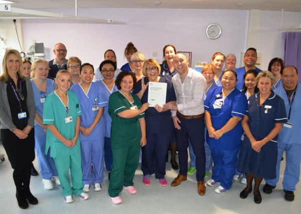 Nursing director Maggie Davies presented the team with their JAG accreditation certificate