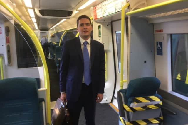 Huw Merriman on board a Southern train SUS-170911-093512001