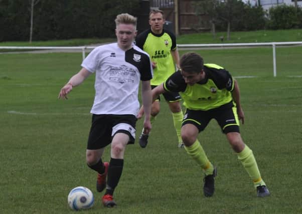 Liam Foster in possession on his Bexhill United debut against Wick last weekend. Pictures by Simon Newstead