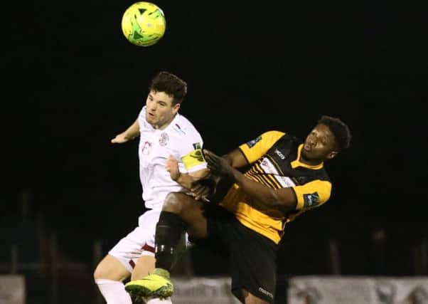 Jack Dixon competes for an aerial ball during Hastings United's 1-1 draw at home to Cray Wanderers on Tuesday night. Picture courtesy Scott White